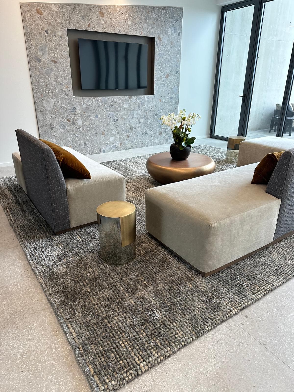 Modern lounge with textured rug by Aja Rugs